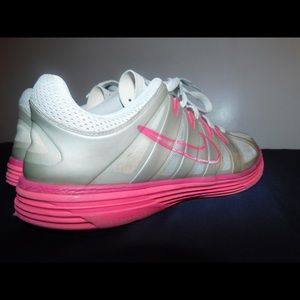 Pink and white Nike running sneakers